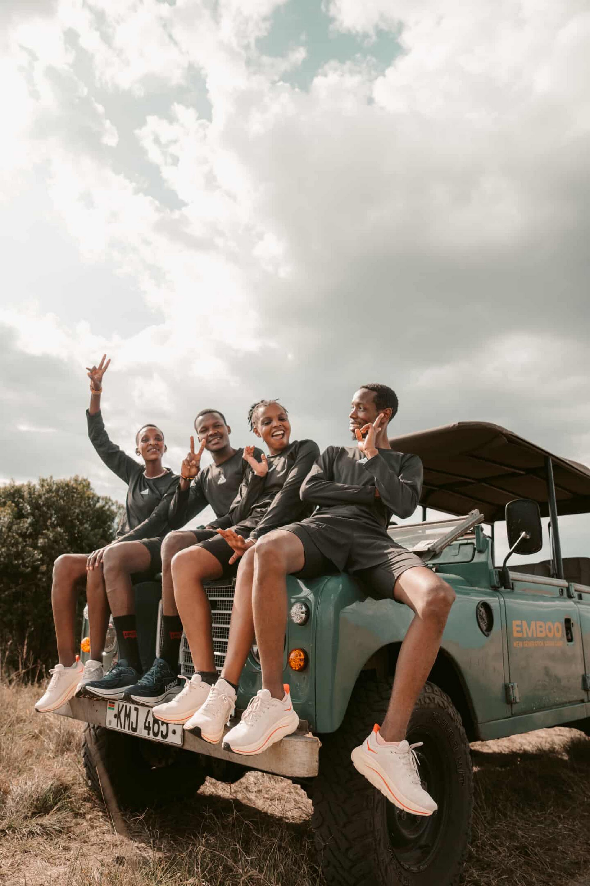 Team sitting on EMBOO safari vehicle